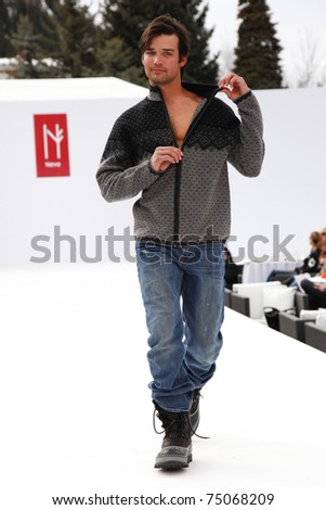 ASPEN, CO - MAR 15: Male model walking the runway at the Neve Designs fashion show at the 2011 Aspen Fashion Week in Aspen, CO on March 15,  2011.