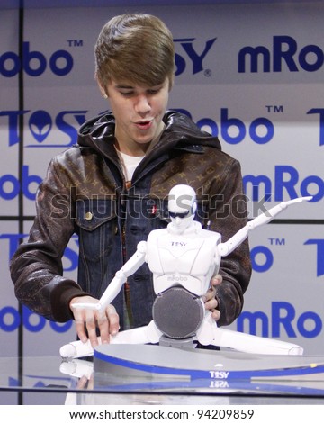 LAS VEGAS - JAN 11: Justin Bieber makes an appearance at the mRobo booth at the Consumer Electronics Show at The Las Vegas Convention Center in Las Vegas, NV on January 11,  2012.