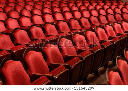 Rows Of Red Velvet Theater Seats In An Old Vaudeville Style Theater.