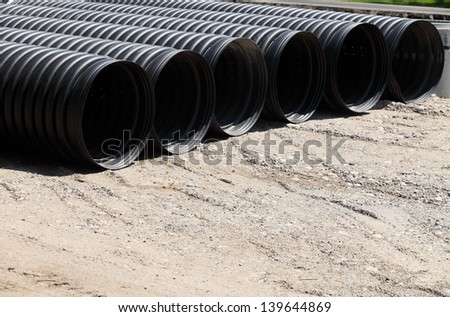 Corrugated plastic pipes at a construction site
