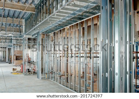 Steel studs used to frame in a large commercial building.
