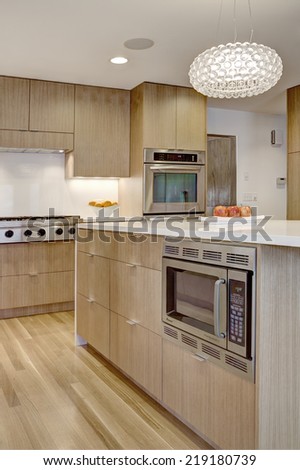 Idaho Falls, ID USA 20 Feb. 2011 An elegant minimalist residential kitchen with modern cabinetry constructed from quarter sawn white oak