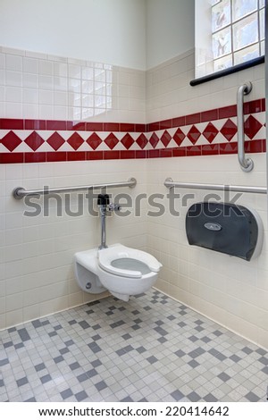 Idaho Falls, Idaho, USA Jun. 4, 2014 The stall for disabled access in a modern men's room, depicting the disabled access and safety bars.