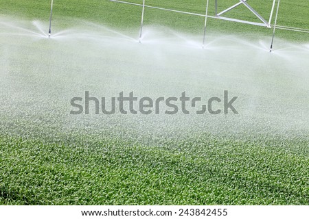 A closeup view of a high tech agricultural sprinkler head water farm crops.