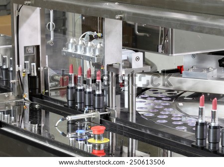 Pocatello, Idaho, USA  June 18, 2012 A machine putting listick in tubes in a cosmetics factory.