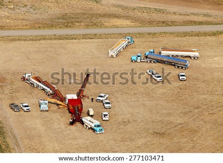 Fort Hall, Idaho, USA 10 Sept, 2014- An aerial view of farmers using machinery to sort and size potatoes.  Then they are placed in a truck where they will be taken to a cellar for winter storage.