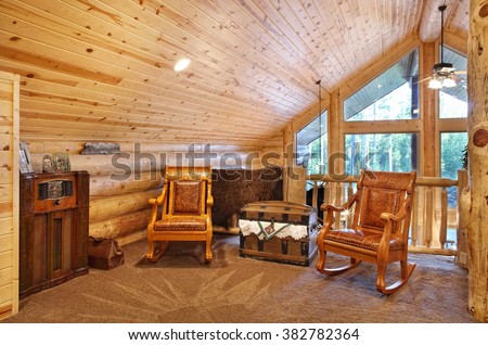 A luxurious loft with comfortable furnishings, in a modern log cabin in the mountains.
