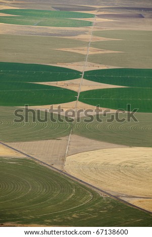 An aerial view of the crop circles created in farm fields by center pivot sprinklers.
