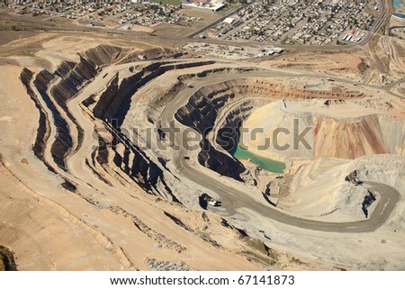 An aerial view of an open pit copper mine.