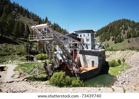 An abandoned decaying gold dredge located on the Yankee Fork of the Salmon River in Custer Idaho, USA