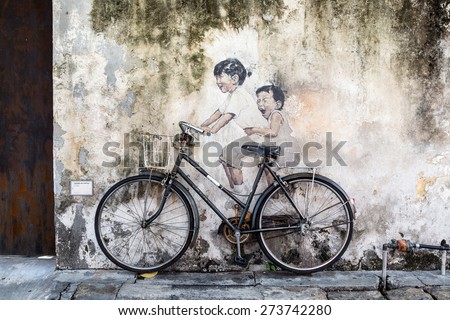 PENANG, MALAYSIA - APRIL 14: on April 15, 2015: street art name Kids on Bicycle in George Town Penang, Malaysia, April 14,2015