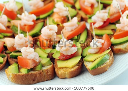 sandwiches  garnish with shrimps, avokado and lettuce close up, snack