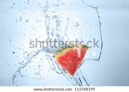 tasty watermelon in splash of water isolated