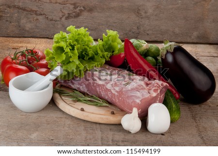 raw meat with vegetables  and porcelain mortar