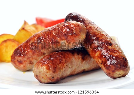 tasty grilled meat sausages on dish