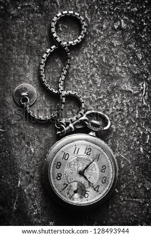 very old watch on the grunge post card and photo