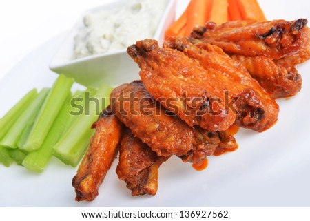 chicken wings with celery, carrot and blue cheese sauce