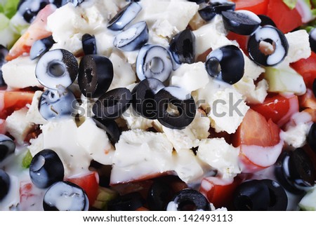 Salad with olives and cheese from fresh vegetables