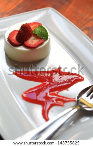 dessert of whipped cream with strawberries and chocolate