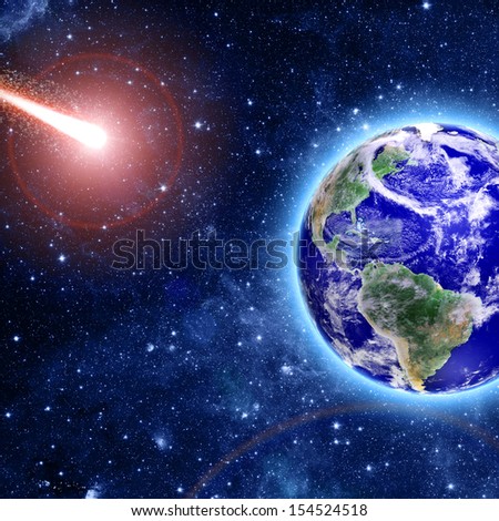 comet coming to blue planet in space  Elements of this image furnished by NASA