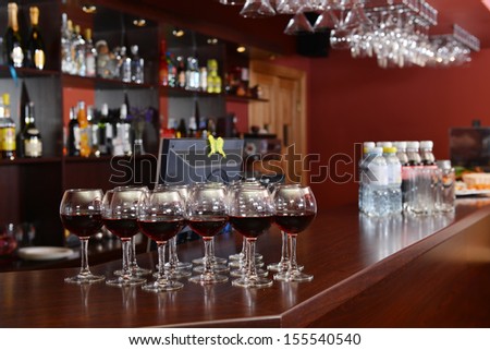 red wine in glasses ready for toasting at wedding reception