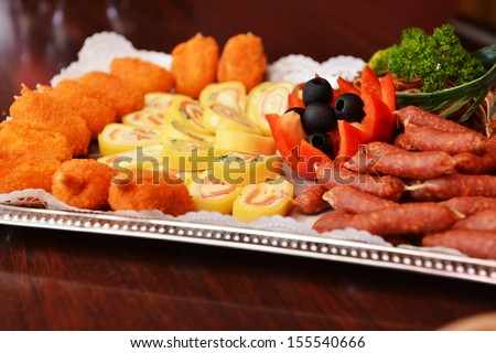 Beer snack with grilled meat, wienerwurst  and vegetables