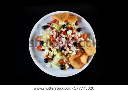 fresh chopped ham salad with cheese on  black background