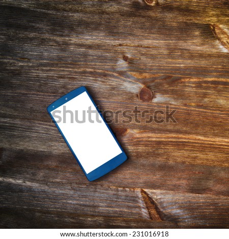 smart phone  on old wooden background