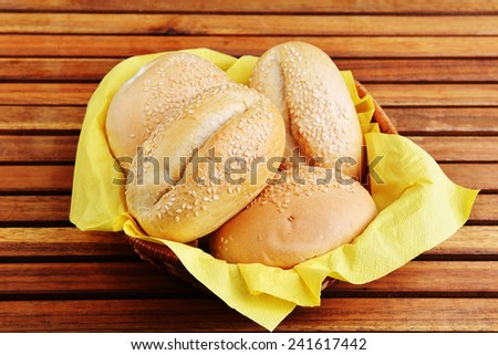 buns with sesame seeds on  yellow napkin