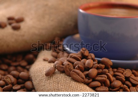 coffee beans cup with coffee old bag and sugar