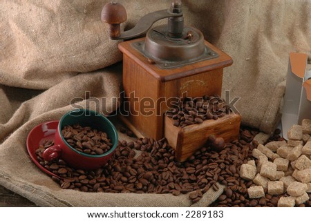 retro coffee grinder with cup and bag