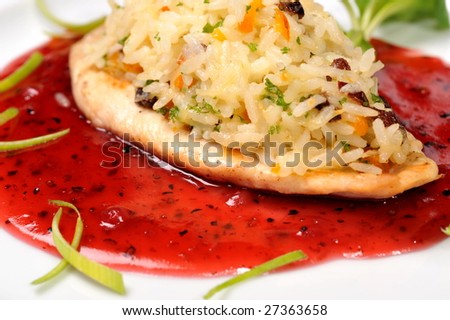 Chicken  with rice in  cowberry sauce