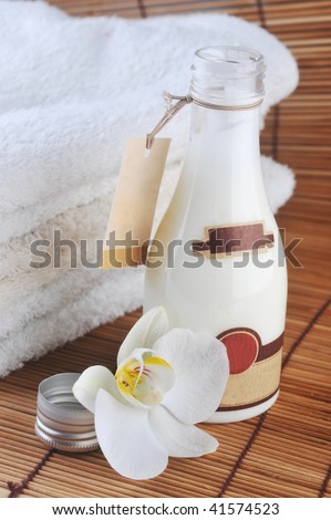 cosmetics for body and  towel on straw napkin