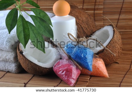 leaves, coconut, towel and salt for  bath on  straw napkin