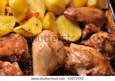 Tasty roast chicken with  potato close up