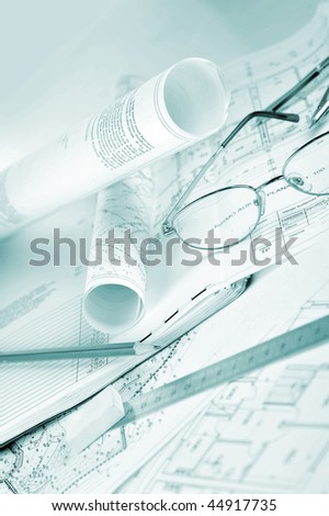 Ruler, eraser, glasses and a pencil on the floor plan - Business a still-life