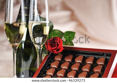 Heart shape chocolate, champagne  and red rose