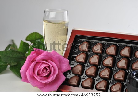 Heart shape chocolate, champagne  and pink rose