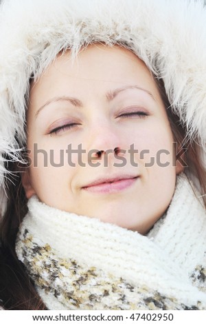 pretty young woman wearing winter outfit with fur portrait