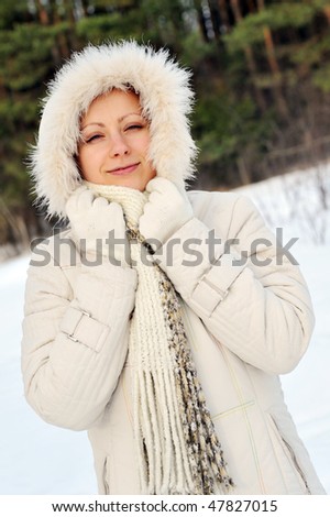 pretty young woman wearing winter outfit with fur
