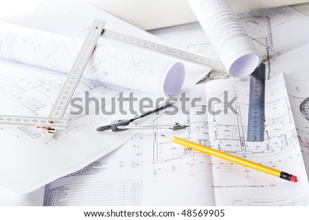 Ruler, eraser, glasses and a pencil on the floor plan - Business a still-life