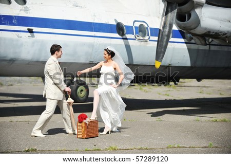 groom and bride fly to wedding travel by  plane
