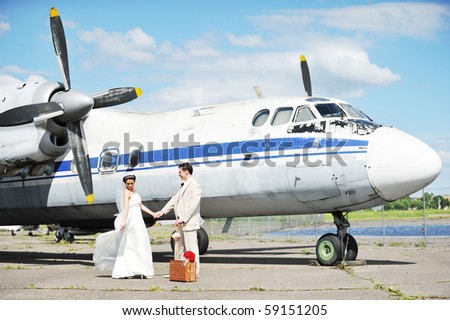 groom and bride fly to wedding travel by  plane