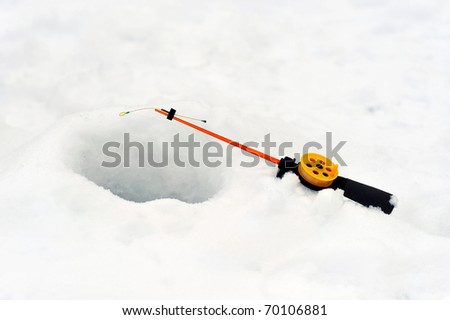 Fishing line in  hole drilled in ice