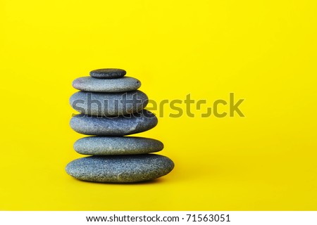 stone tower isolated on yellow background