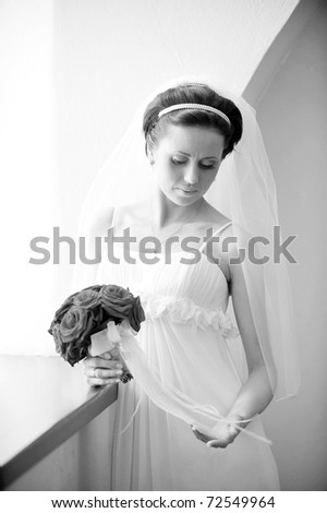 Studio portrait of beautiful stylish bride