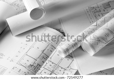 heap of design and project drawings on  table  background.
