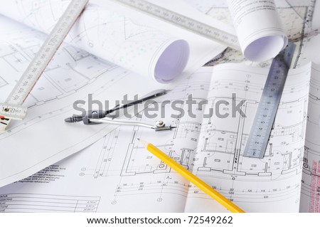 Ruler, eraser, glasses and a pencil on the floor plan