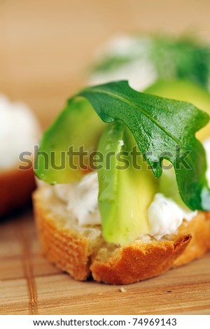 delicious sandwich of toasted bread, avocado and spinach