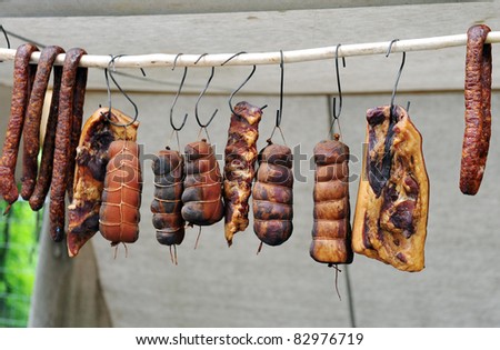 Selection of cold meat (ham smoked, sirloin, headcheese, sausages) at outdoor market